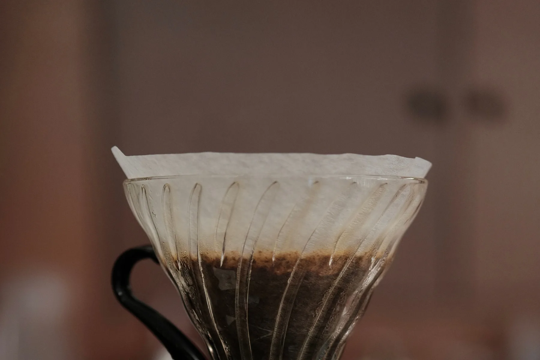Coffee drawing down through a paper filter